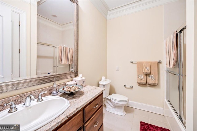 311 N Rivoli Farms Dr, Macon, GA 31210 - bathroom featuring ornamental molding, vanity, tile patterned floors, and combined bath / shower with glass door