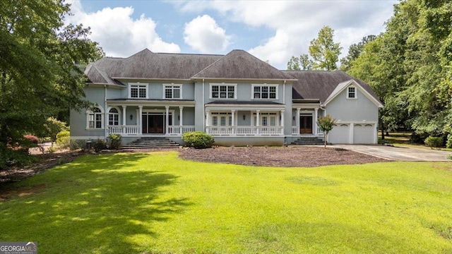 311 N Rivoli Farms Dr, Macon, GA 31210 - view of front of property featuring a porch, a front lawn, and driveway