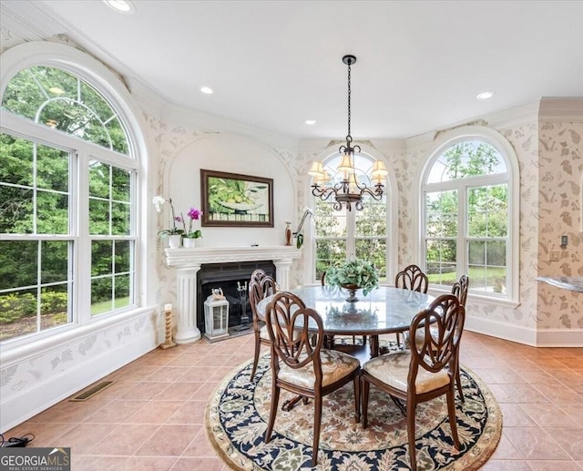 311 N Rivoli Farms Dr, Macon, GA 31210 - dining space featuring wallpapered walls, healthy amount of natural light, light tile patterned flooring, a chandelier, and recessed lighting