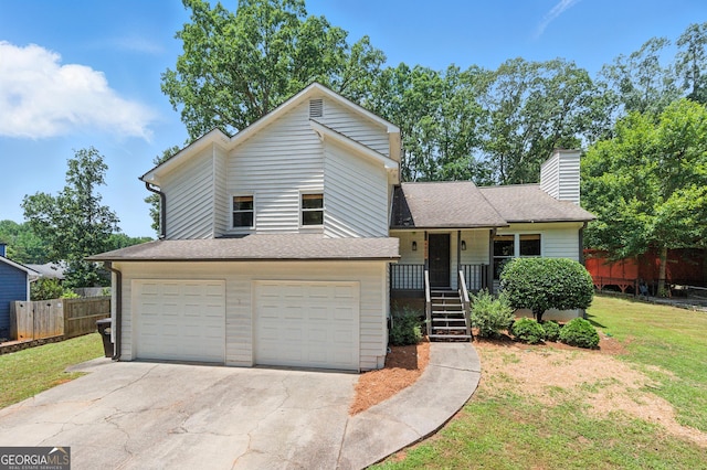 4829 Caboose Ln NW, Acworth, GA 30102 - tri-level home featuring an attached garage, concrete driveway, a chimney, and roof with shingles