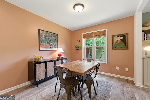 4829 Caboose Ln NW, Acworth, GA 30102 - dining area featuring light wood-style flooring and baseboards
