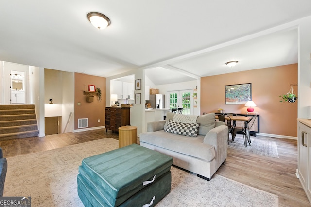 4829 Caboose Ln NW, Acworth, GA 30102 - living room featuring light wood-style flooring, stairs, and french doors