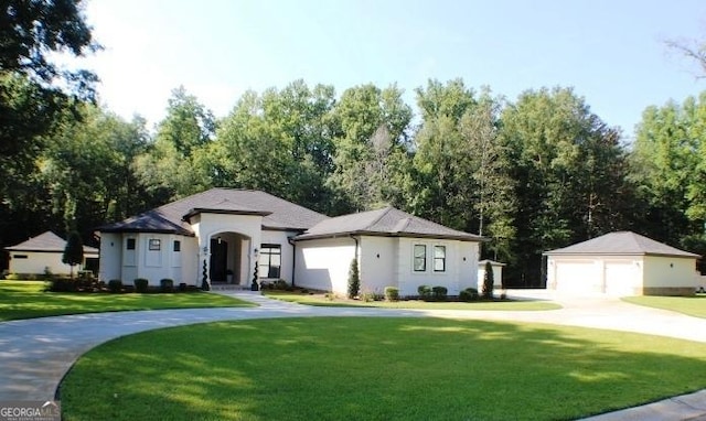 896 Bobby Jones Dr, Dublin, GA 31021 - view of front facade with a garage, a front yard, and an outdoor structure