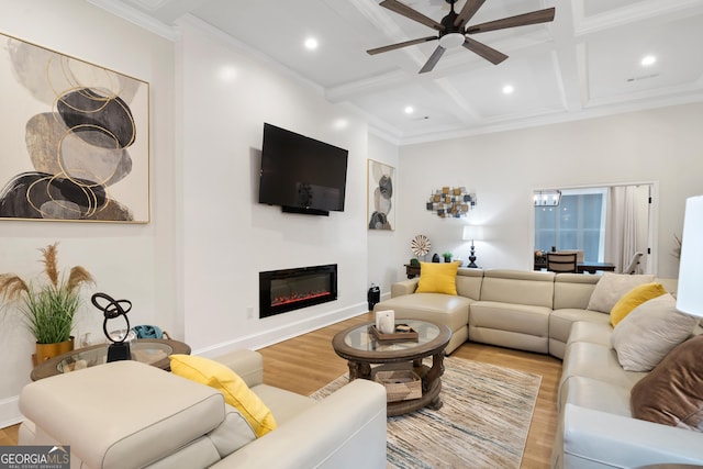 896 Bobby Jones Dr, Dublin, GA 31021 - living room with wood finished floors, a ceiling fan, beamed ceiling, a glass covered fireplace, and coffered ceiling