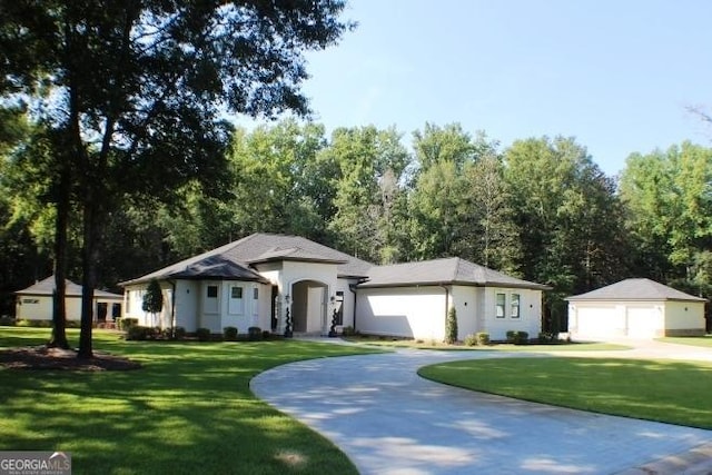 896 Bobby Jones Dr, Dublin, GA 31021 - ranch-style home with a front yard, a garage, and an outdoor structure