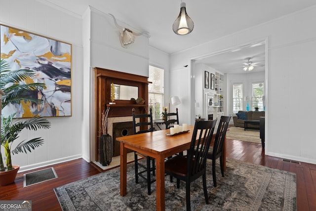 303 W 39th St, Savannah, GA 31405 - dining space with hardwood / wood-style flooring, ceiling fan, a decorative wall, and crown molding