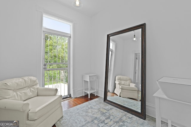 303 W 39th St, Savannah, GA 31405 - living area featuring wood finished floors and baseboards