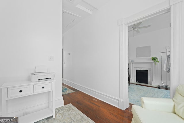 303 W 39th St, Savannah, GA 31405 - walk in closet featuring dark wood-type flooring, a ceiling fan, a brick fireplace, and attic access
