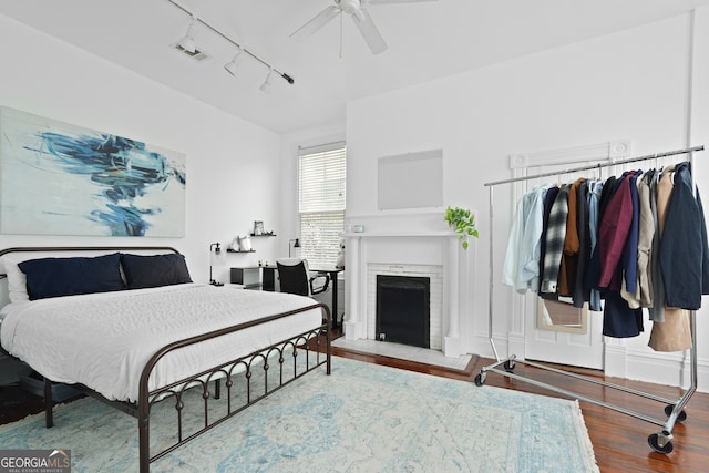 303 W 39th St, Savannah, GA 31405 - bedroom featuring track lighting, wood finished floors, a fireplace, and ceiling fan