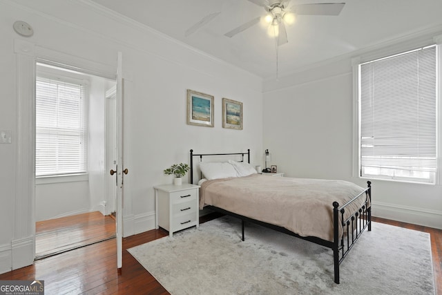 303 W 39th St, Savannah, GA 31405 - bedroom with dark wood-style flooring, multiple windows, crown molding, and ceiling fan