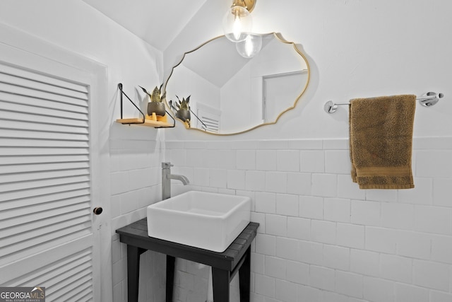 303 W 39th St, Savannah, GA 31405 - bathroom with tile walls, a wainscoted wall, and lofted ceiling