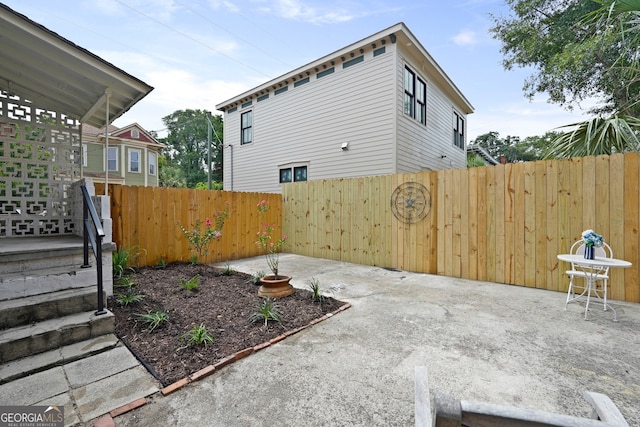 303 W 39th St, Savannah, GA 31405 - fenced backyard with a patio