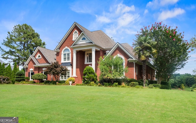 1005 Lyndhurst Way SE, Conyers, GA 30013 - neoclassical / greek revival house with a front lawn and brick siding
