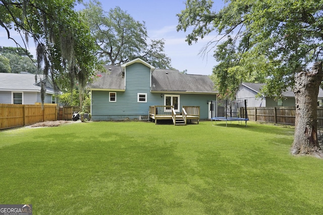 126 S Sheftall Cir, Savannah, GA 31410 - rear view of property featuring a wooden deck, a fenced backyard, a trampoline, and crawl space