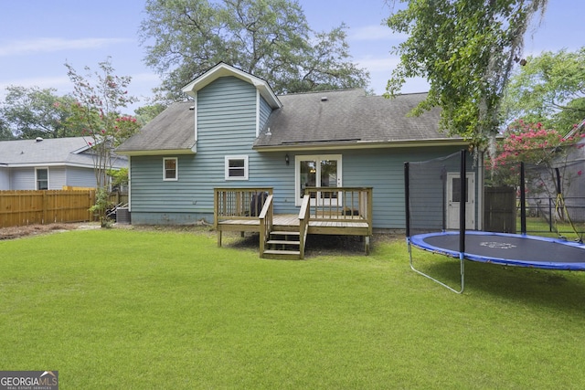 126 S Sheftall Cir, Savannah, GA 31410 - rear view of property featuring a trampoline, a deck, and a shingled roof