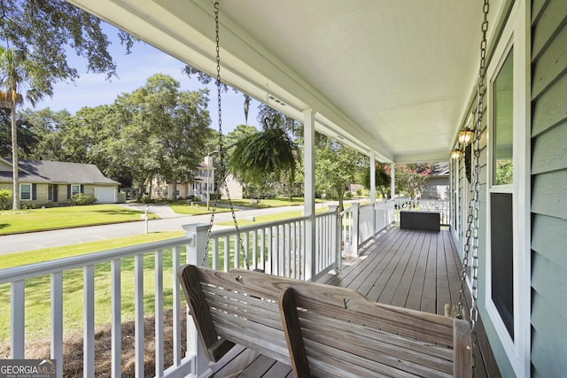 126 S Sheftall Cir, Savannah, GA 31410 - wooden porch featuring a yard and a residential view