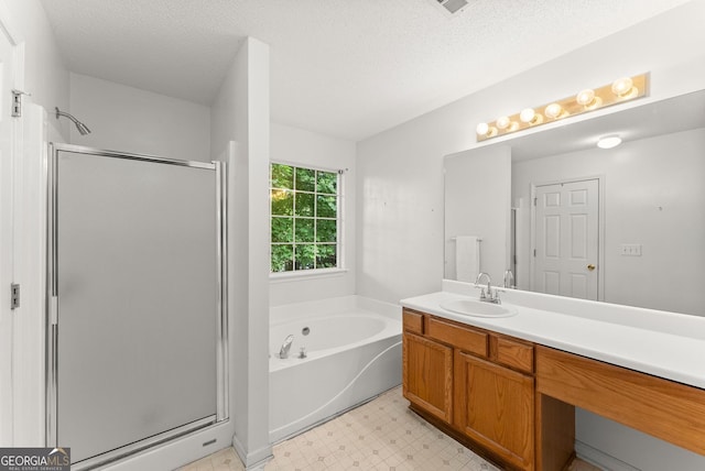 4015 Snowshoe Ct NW, Acworth, GA 30101 - full bath featuring a shower stall, tile patterned floors, vanity, a bath, and a textured ceiling