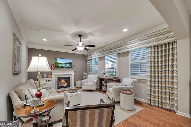 236 Creek View Ln, Acworth, GA 30102 - living area featuring crown molding, a fireplace with flush hearth, wood finished floors, a ceiling fan, and recessed lighting