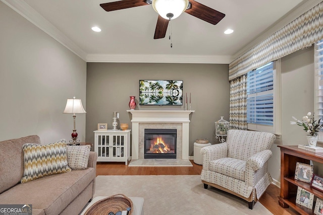 236 Creek View Ln, Acworth, GA 30102 - living area featuring crown molding, wood finished floors, a tile fireplace, ceiling fan, and recessed lighting