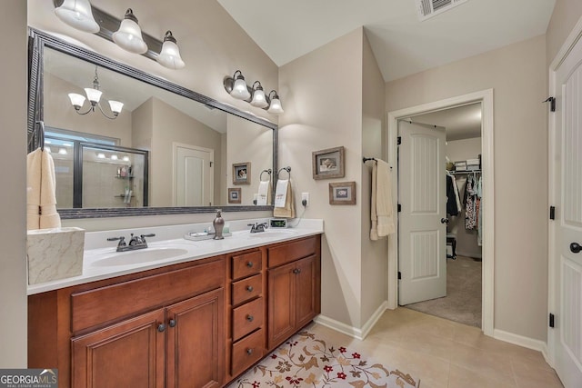 236 Creek View Ln, Acworth, GA 30102 - full bathroom with double vanity, a shower stall, tile patterned flooring, and a spacious closet