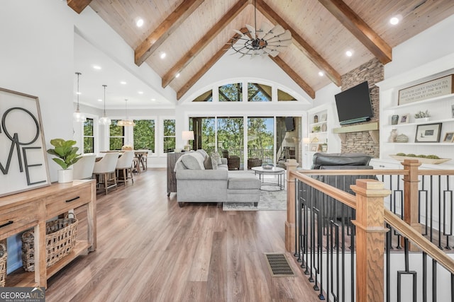 123 River Point Rd, Jackson, GA 30233 - living area with high vaulted ceiling, wood finished floors, a wooden ceiling with exposed beams, and recessed lighting