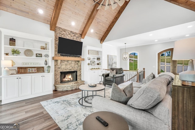 123 River Point Rd, Jackson, GA 30233 - living room with wood finished floors, a stone fireplace, recessed lighting, high vaulted ceiling, and a wooden ceiling with exposed beams