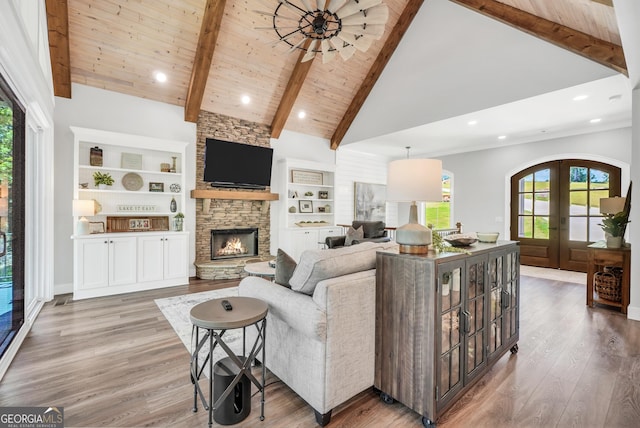 123 River Point Rd, Jackson, GA 30233 - living area with a stone fireplace, wood finished floors, french doors, high vaulted ceiling, and recessed lighting