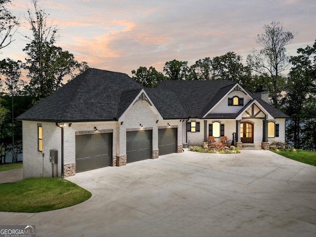 123 River Point Rd, Jackson, GA 30233 - view of front of home featuring driveway, a garage, brick siding, roof with shingles, and a chimney