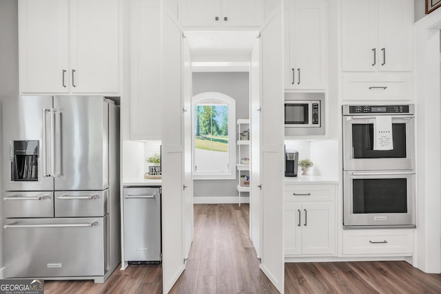 123 River Point Rd, Jackson, GA 30233 - kitchen with stainless steel appliances, dark wood-style floors, light countertops, and white cabinetry