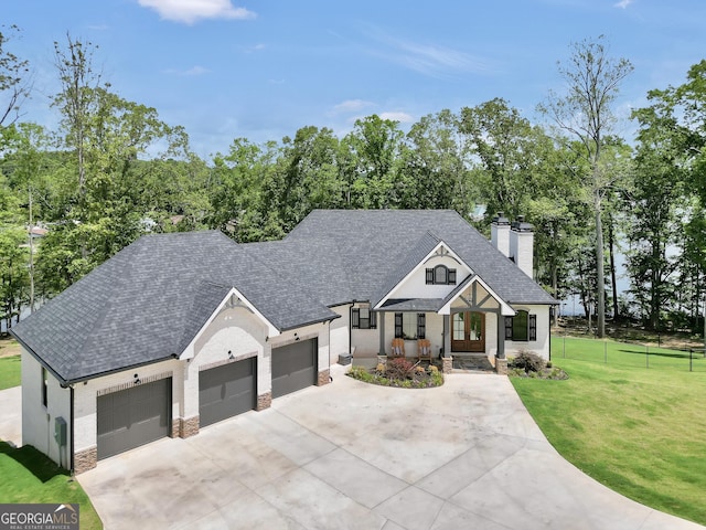 123 River Point Rd, Jackson, GA 30233 - modern farmhouse with concrete driveway, a chimney, an attached garage, roof with shingles, and brick siding