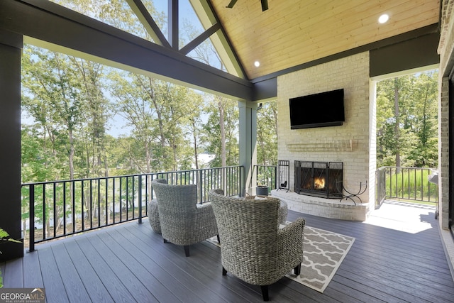 123 River Point Rd, Jackson, GA 30233 - deck featuring an outdoor brick fireplace and view of scattered trees