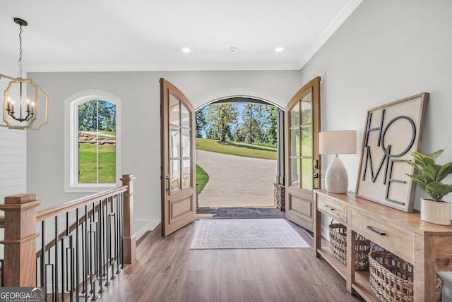 123 River Point Rd, Jackson, GA 30233 - foyer entrance with a chandelier, healthy amount of natural light, wood finished floors, ornamental molding, and recessed lighting