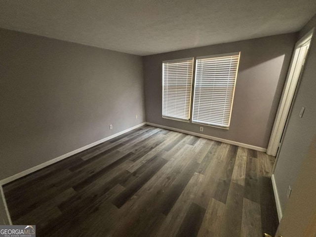 6353 Wedgeview Ct, Tucker, GA 30084 - unfurnished room with baseboards and dark wood finished floors