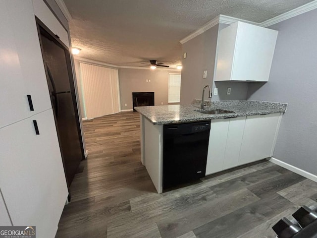 6353 Wedgeview Ct, Tucker, GA 30084 - kitchen with black dishwasher, ceiling fan, white cabinetry, a fireplace, and a textured ceiling