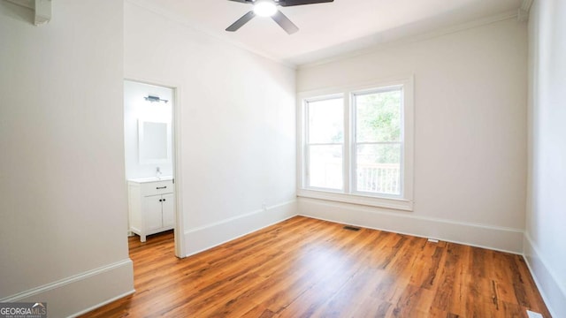 220 Confederate Ave, Dallas, GA 30132 - empty room with ornamental molding, light wood-style floors, and a ceiling fan