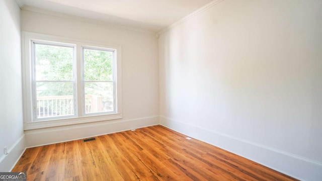 220 Confederate Ave, Dallas, GA 30132 - empty room featuring ornamental molding and light wood finished floors