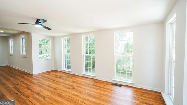 220 Confederate Ave, Dallas, GA 30132 - unfurnished room featuring wood finished floors, healthy amount of natural light, and a ceiling fan
