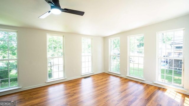 220 Confederate Ave, Dallas, GA 30132 - spare room with wood finished floors, a ceiling fan, and vaulted ceiling
