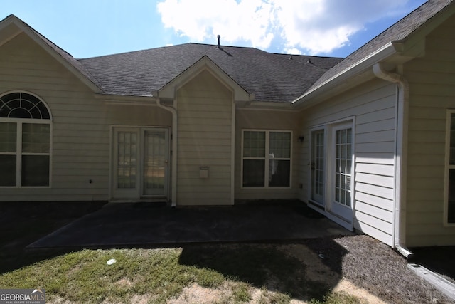 3858 Parham Way S, Fulton, GA 30349 - rear view of house with a shingled roof and a patio area