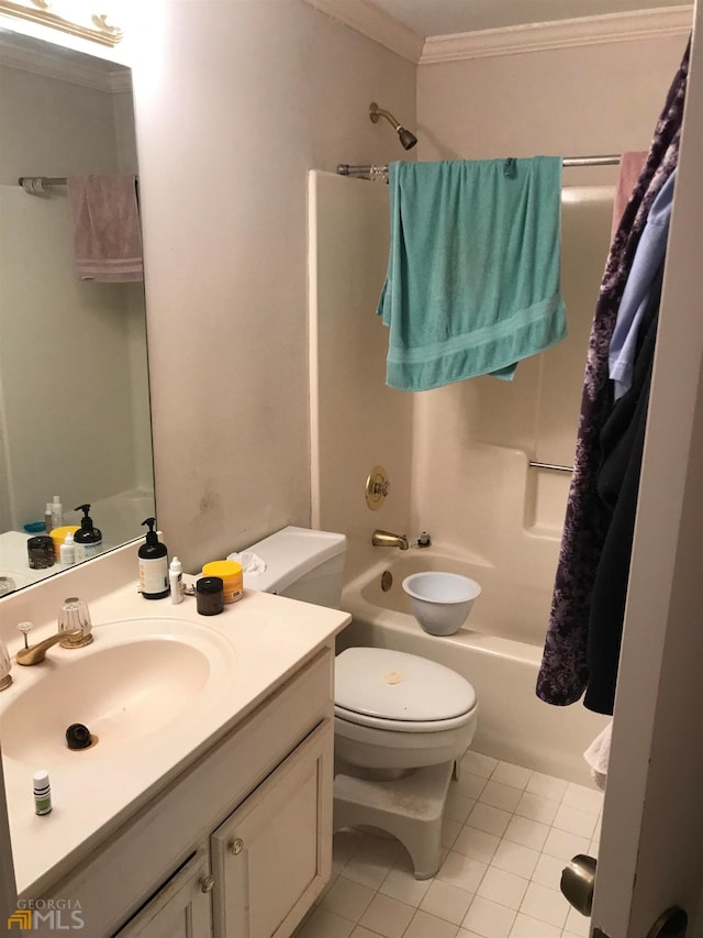 full bathroom featuring oversized vanity, tile flooring, toilet, ornamental molding, and bathing tub / shower combination