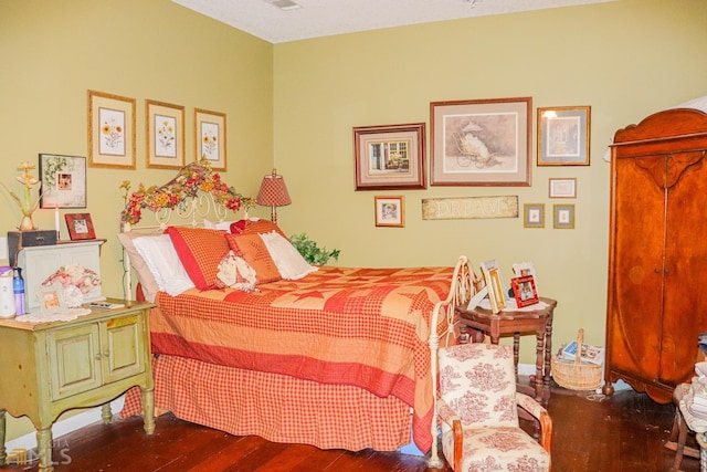 bedroom featuring dark hardwood / wood-style floors