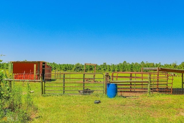 view of yard with a rural view