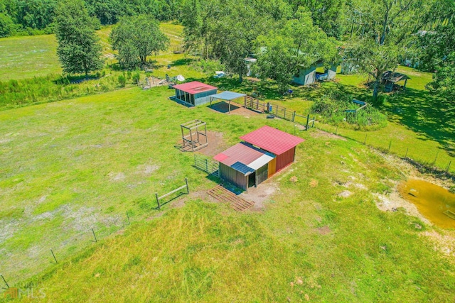 birds eye view of property with a rural view