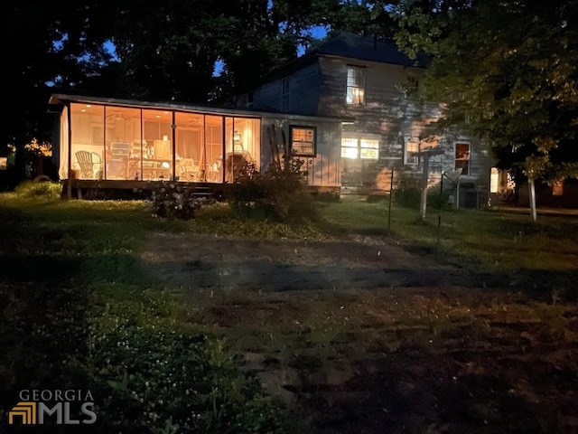 view of back house at night