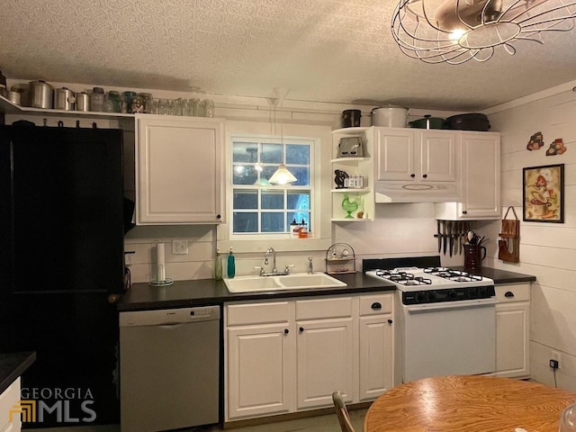 kitchen featuring pendant lighting, sink, white appliances, and white cabinets