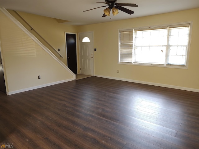 entrance foyer featuring ceiling fan and dark wood-type flooring