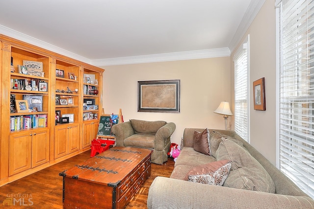 living room with plenty of natural light, dark hardwood / wood-style floors, and ornamental molding