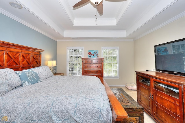 bedroom featuring crown molding, ceiling fan, and a tray ceiling