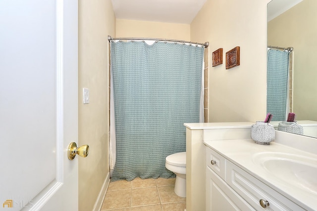 bathroom with vanity, tile flooring, and toilet