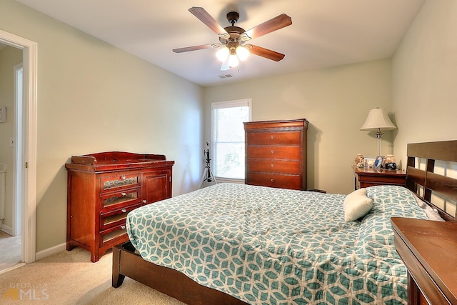 bedroom featuring ceiling fan and light colored carpet